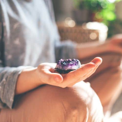 holding a crystal for grief and loss